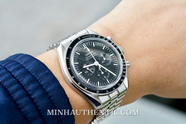 Hand on Omega Moonwatch